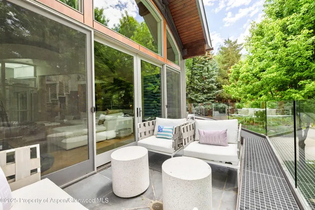 a view of a patio with couches and pool