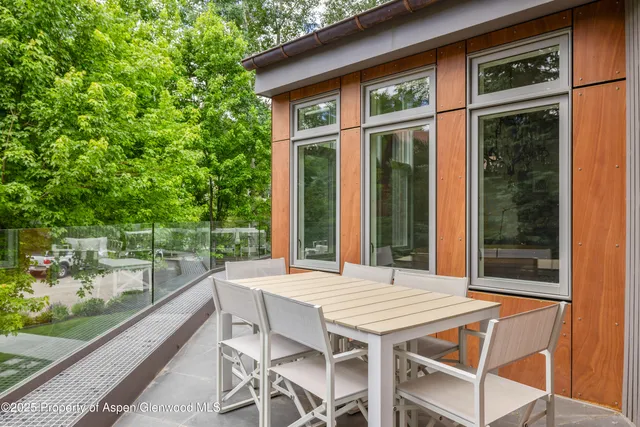 a bedroom with a large bed and a flat screen tv