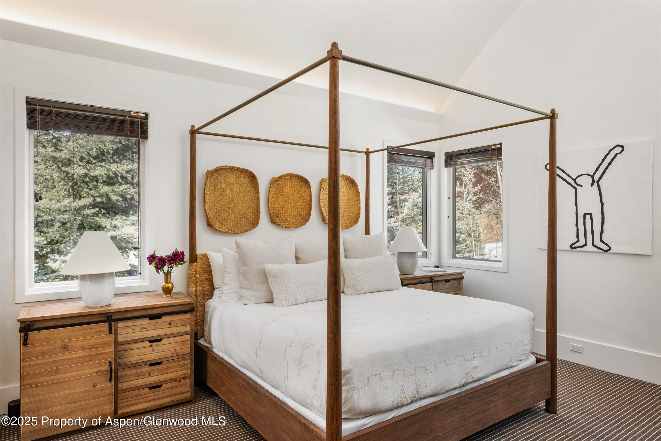 63 Smuggler Grove Aspen, CO 81611 - Photo 27 of 58 a bedroom with a bed and a window