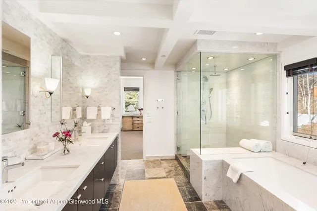 a bedroom with a bed and flat screen tv