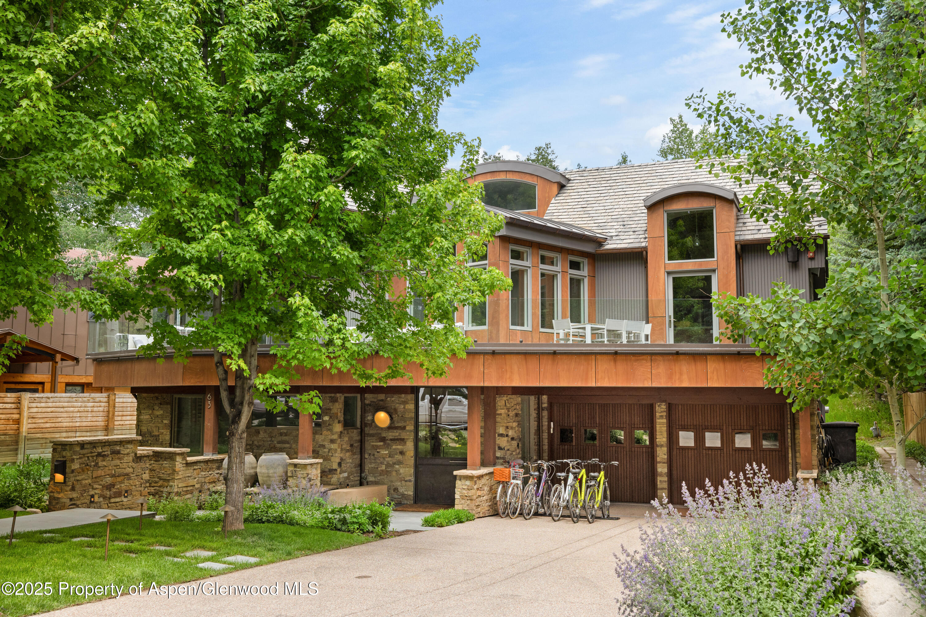 63 Smuggler Grove Aspen, CO 81611 - Photo 4 of 58 front view of a house with a porch