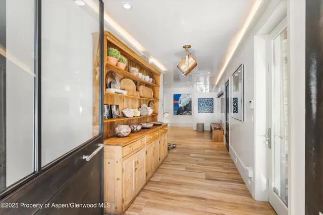 a balcony view with a large window and outdoor seating