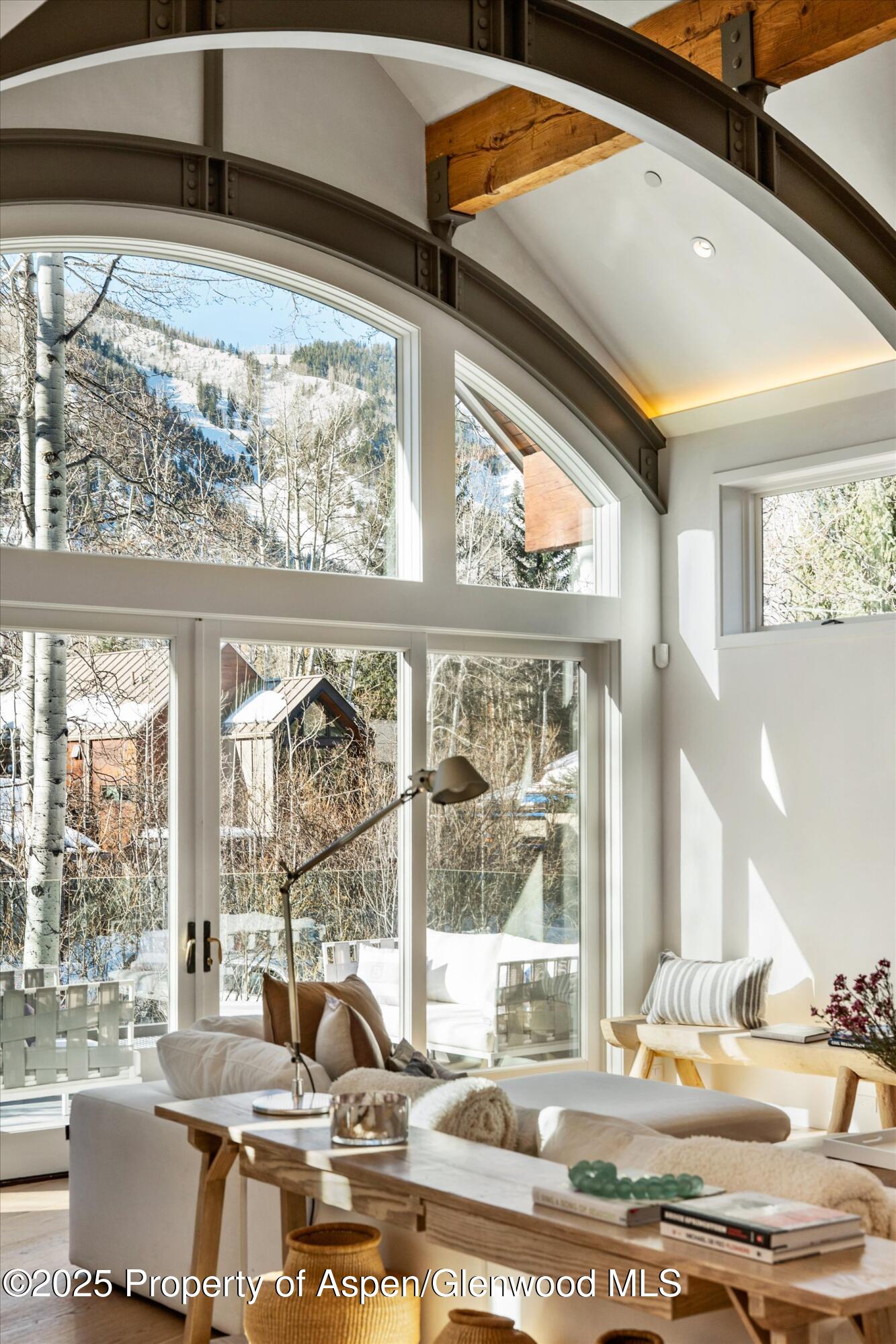 63 Smuggler Grove Aspen, CO 81611 - Photo 7 of 58 a dining room with a large window and table