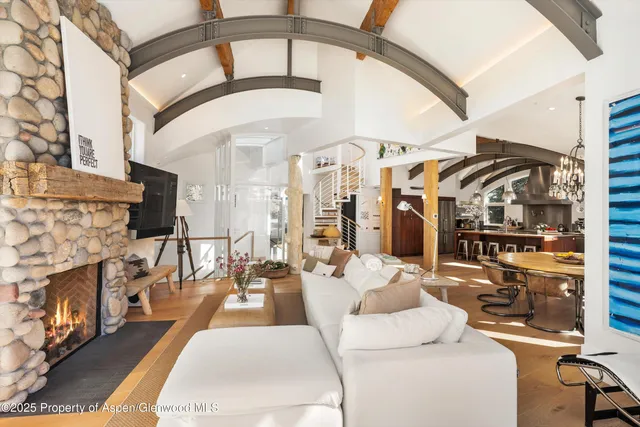 a living room with fireplace furniture and a fireplace