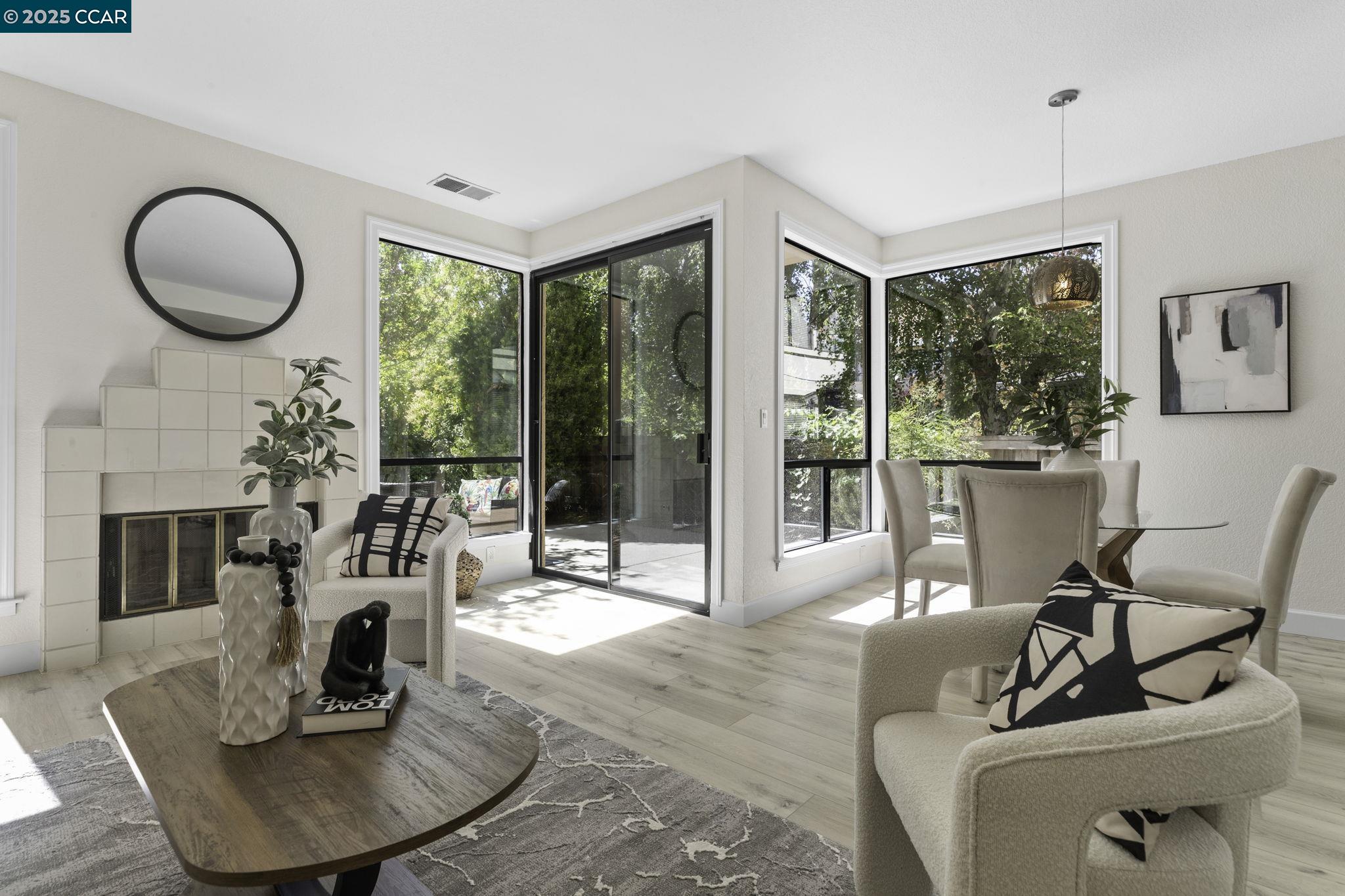 731 Lakemont Place, Unit 7 San Ramon, CA 94582 - Photo 11 of 55 a living room with furniture a fireplace and a floor to ceiling window
