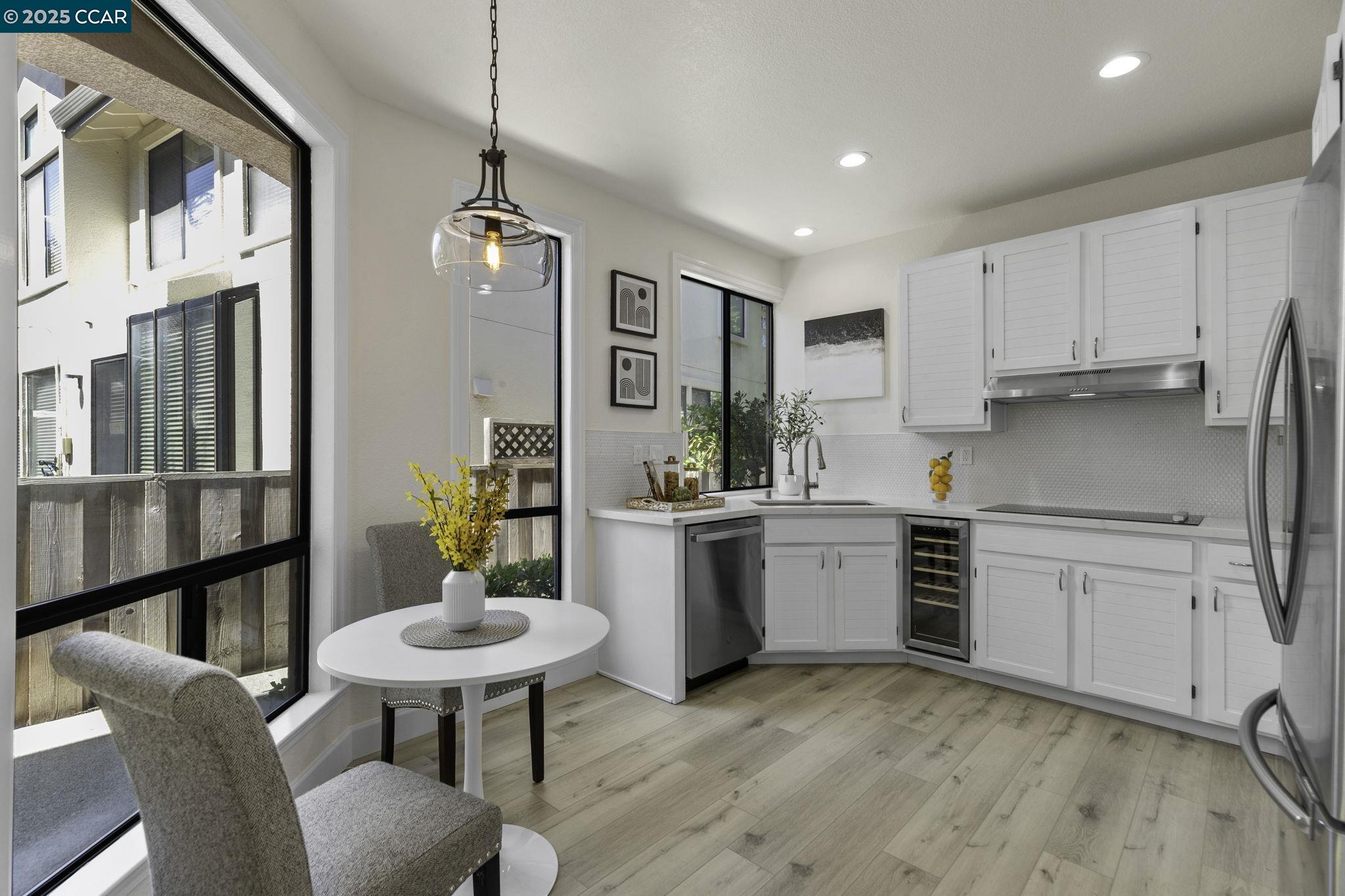731 Lakemont Place, Unit 7 San Ramon, CA 94582 - Photo 17 of 55 a kitchen with white cabinets and stainless steel appliances