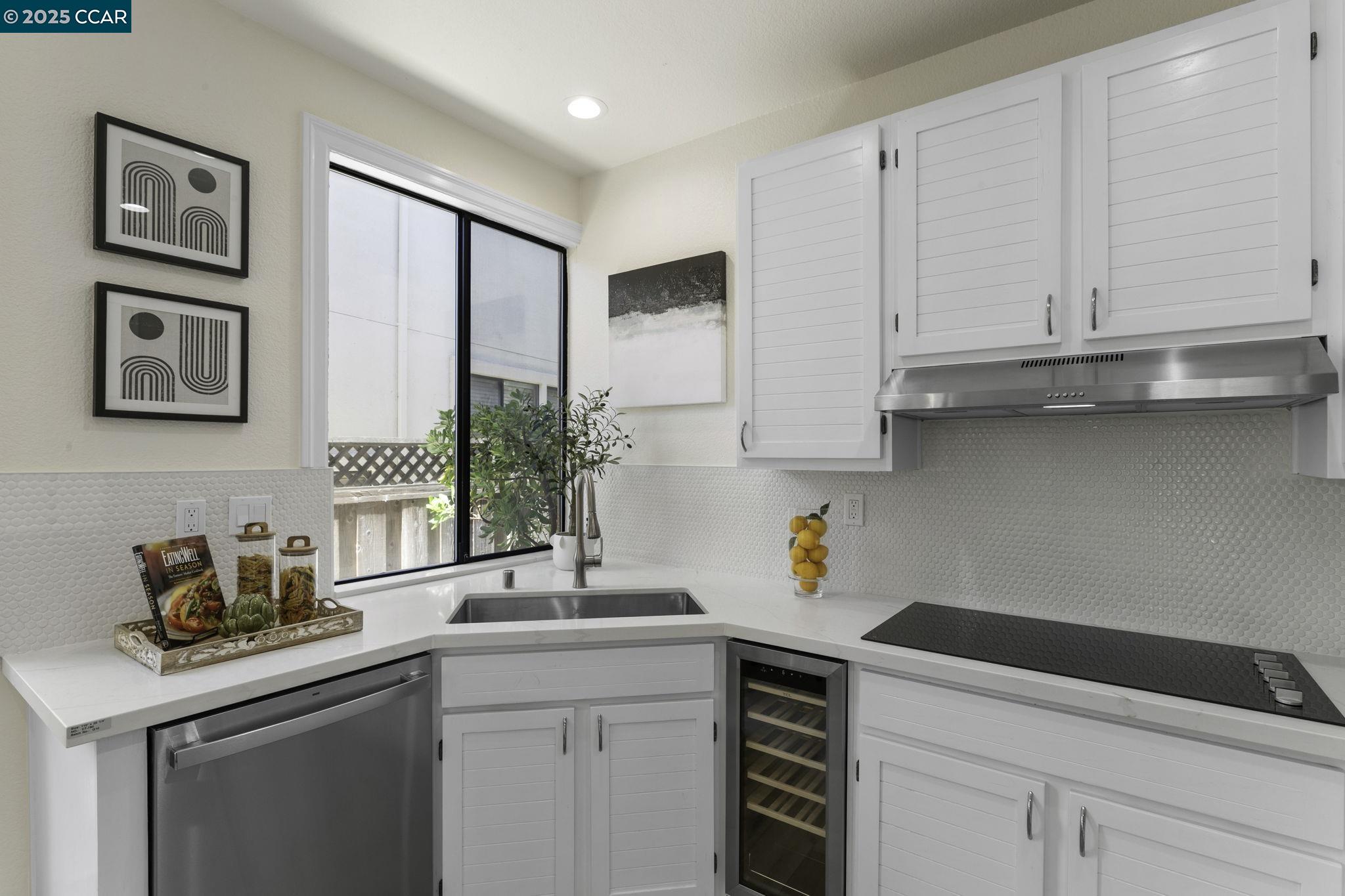 731 Lakemont Place, Unit 7 San Ramon, CA 94582 - Photo 19 of 55 a kitchen with stainless steel appliances white cabinets and a sink