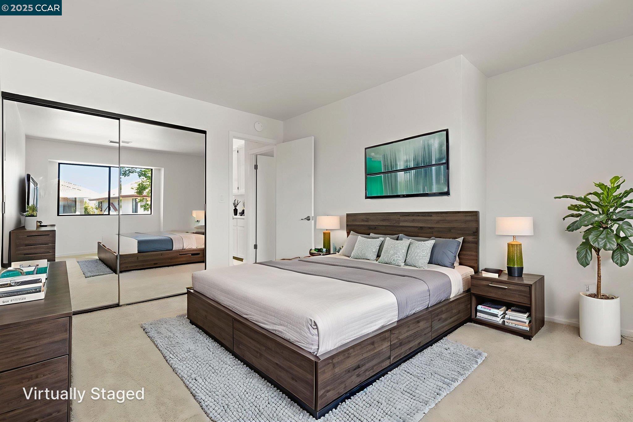 731 Lakemont Place, Unit 7 San Ramon, CA 94582 - Photo 34 of 55 a large bedroom with a bed and a potted plant