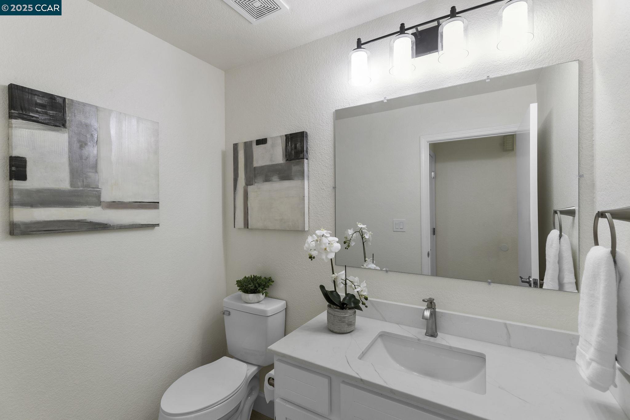 731 Lakemont Place, Unit 7 San Ramon, CA 94582 - Photo 41 of 55 a bathroom with a sink toilet and mirror