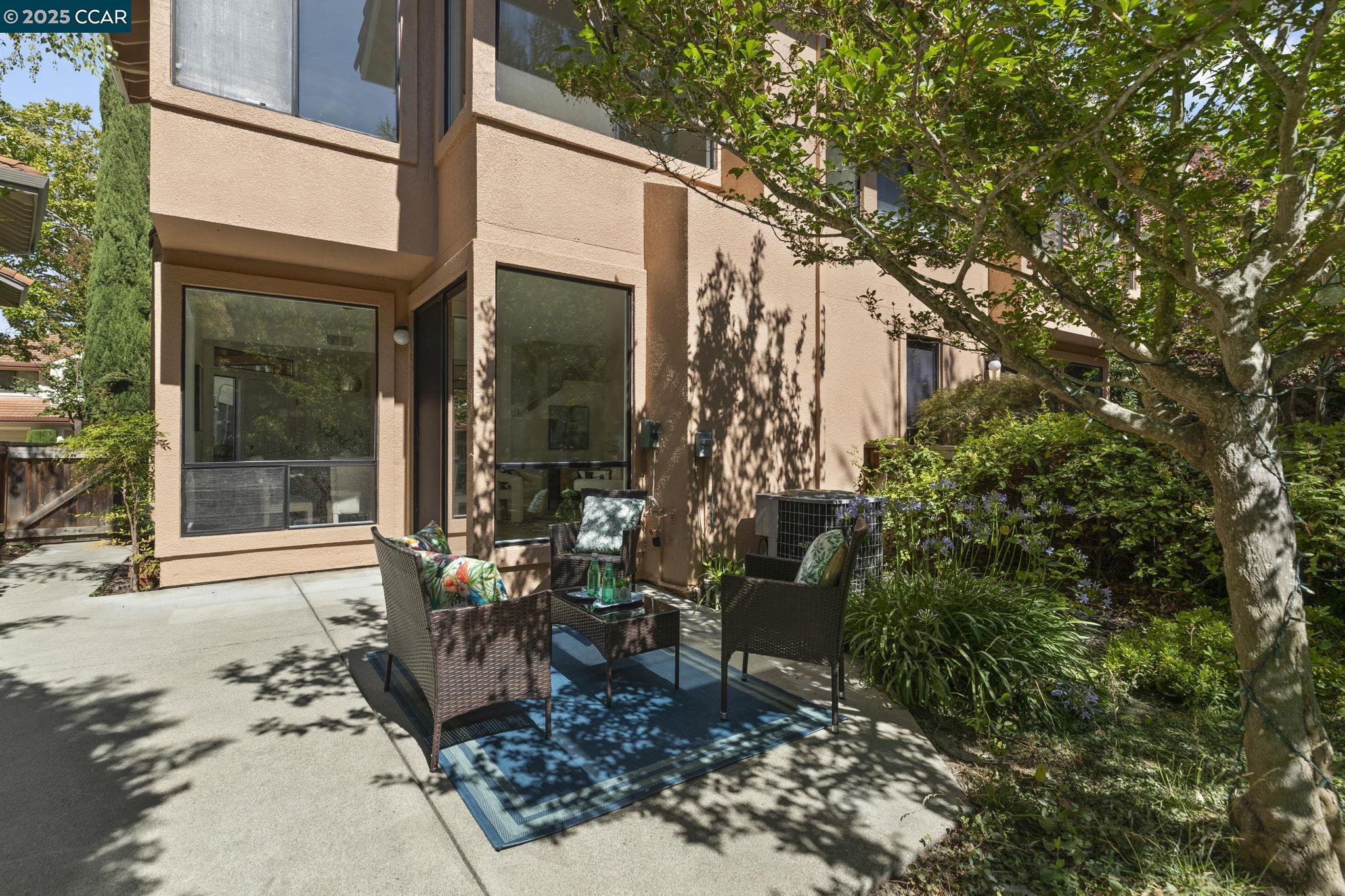 731 Lakemont Place, Unit 7 San Ramon, CA 94582 - Photo 42 of 55 a view of a two chairs in the patio in front of a house