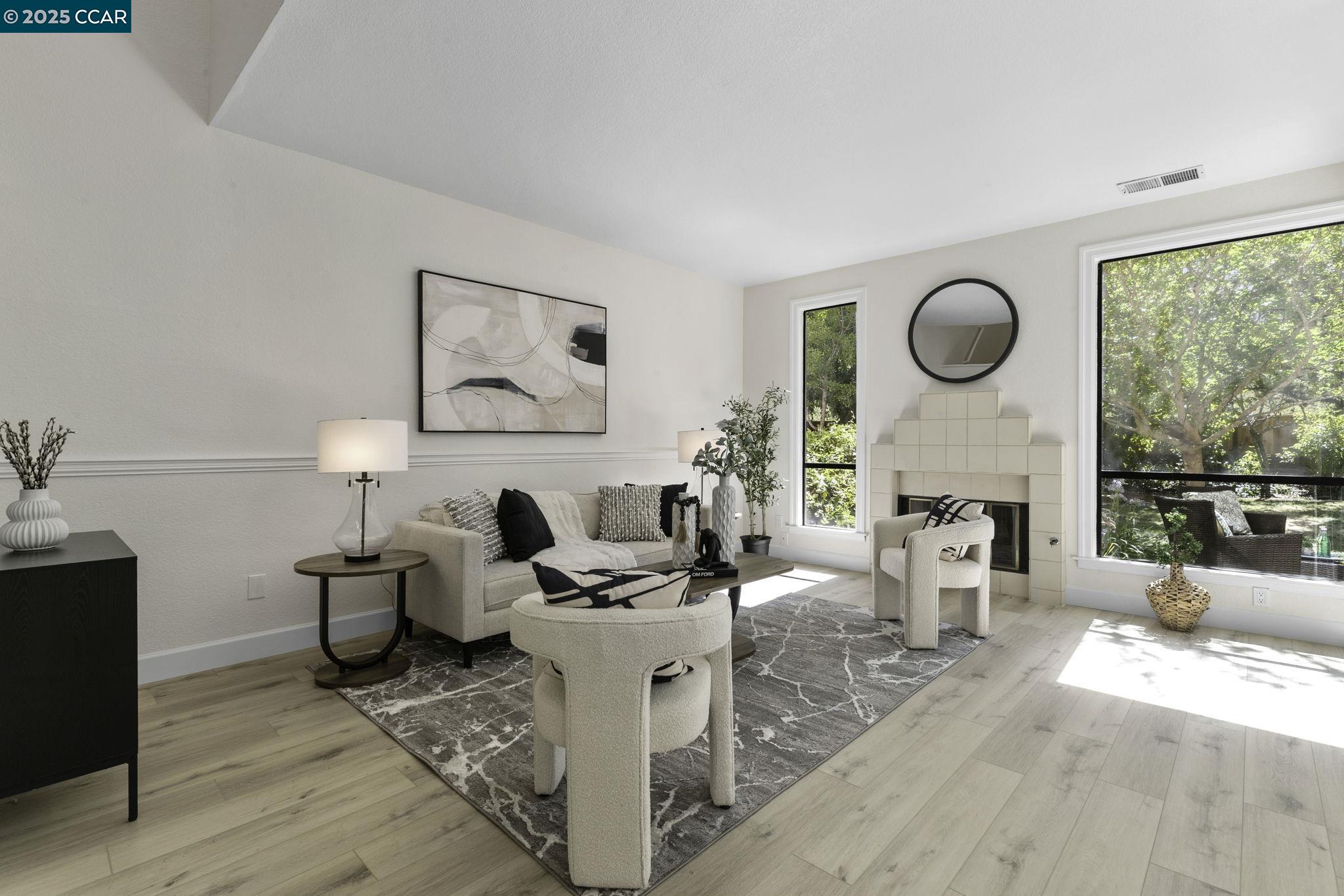 731 Lakemont Place, Unit 7 San Ramon, CA 94582 - Photo 8 of 55 a living room with fireplace furniture and a large window