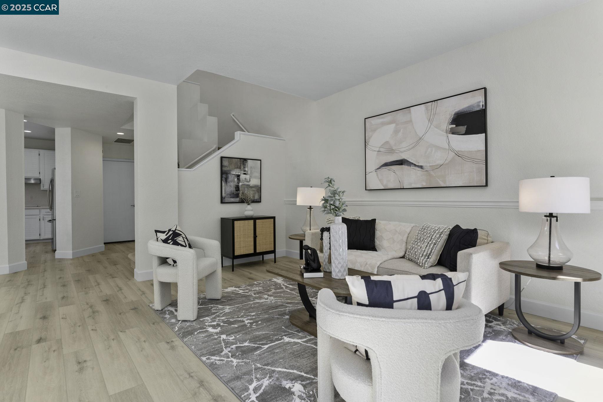 731 Lakemont Place, Unit 7 San Ramon, CA 94582 - Photo 9 of 55 a living room with furniture and wooden floor