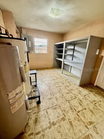 a bed room with a bed and cabinets