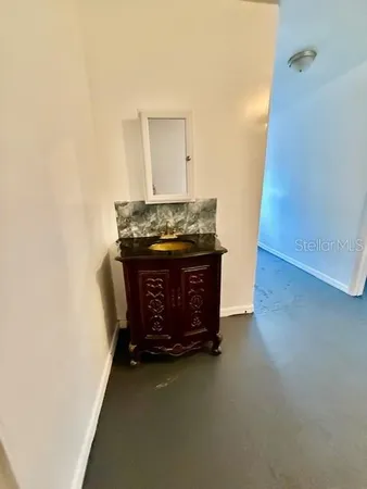 a bed room with a bed and a mirror