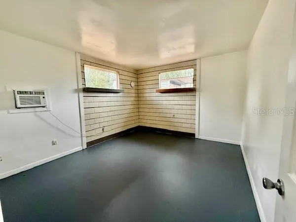 a view of a room with cabinet and mirrors