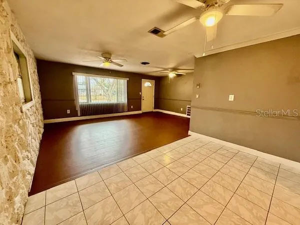 a view of an empty room and window