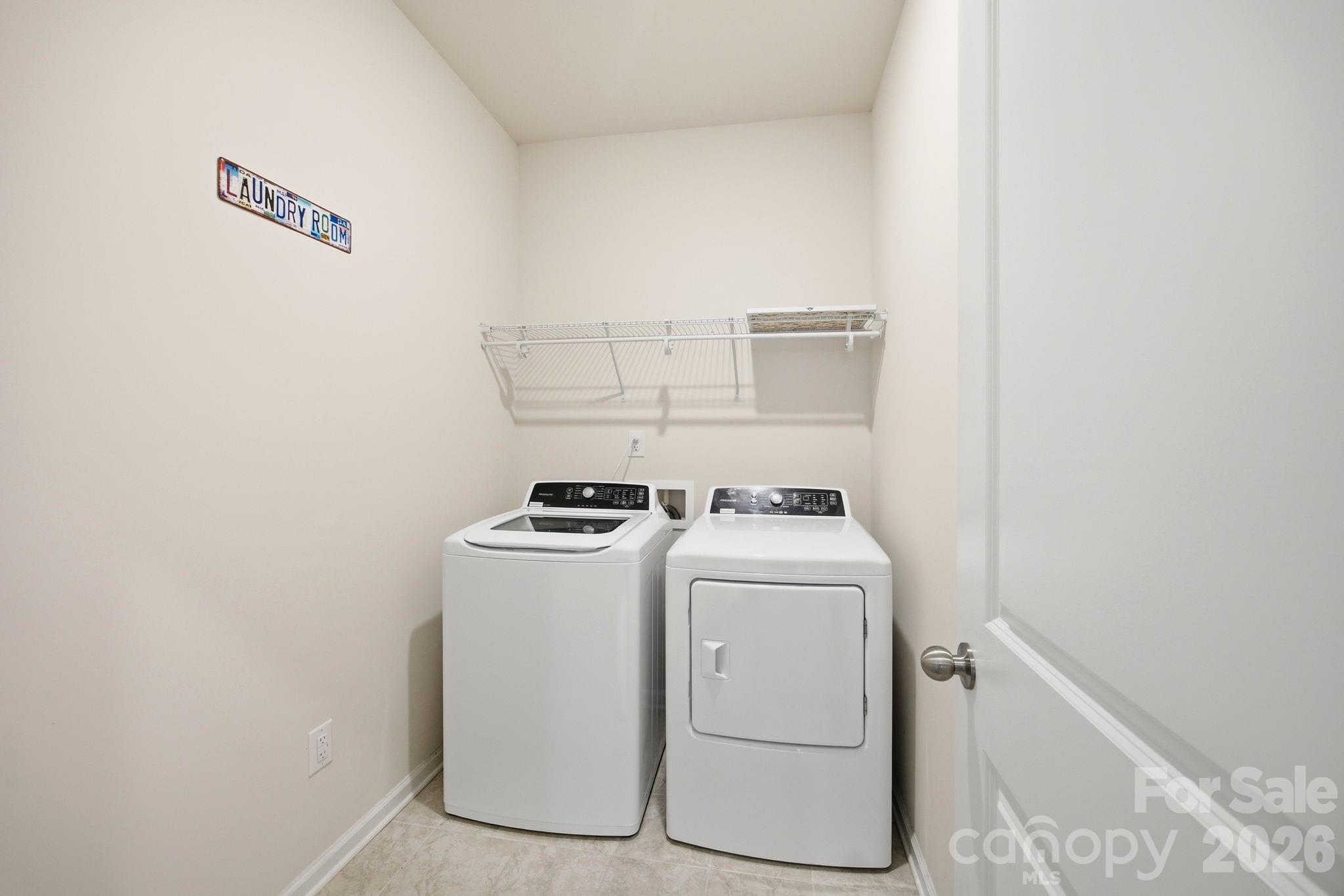 234 Hamptons Cove Road Troutman, NC 28166 - Photo 13 of 32 a utility room with dryer and washer