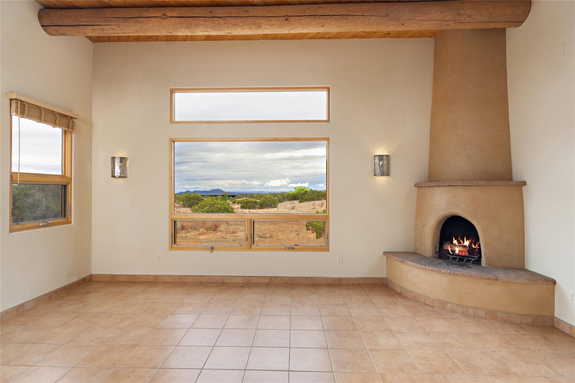5 Rico Court Santa Fe, NM 87508 - Photo 9 of 32 Living room with kiva fireplace