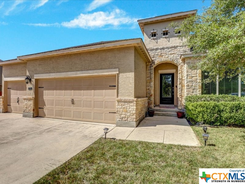 2725 Cedar Rdg Drive New Braunfels, TX 78132 - Photo 1 of 1 a front view of a house with garden