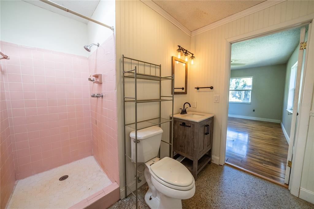 1740 Southeast 164th Circle Ocklawaha, FL 32179 - Photo 24 of 48 a bathroom with a toilet a sink and shower