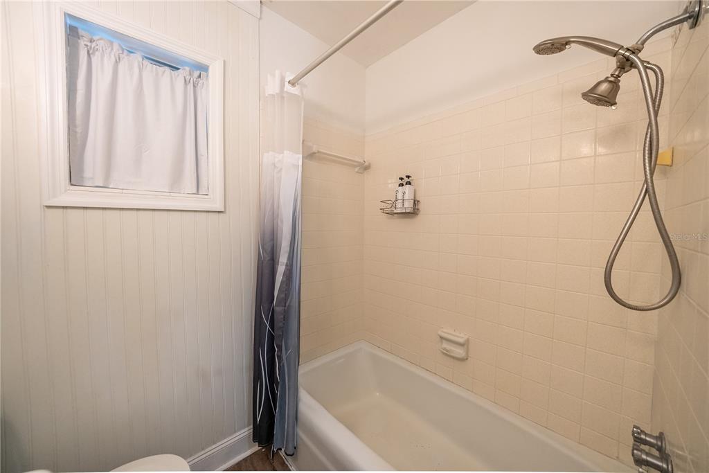 1740 Southeast 164th Circle Ocklawaha, FL 32179 - Photo 33 of 48 a bathroom with a bath tub with a shower