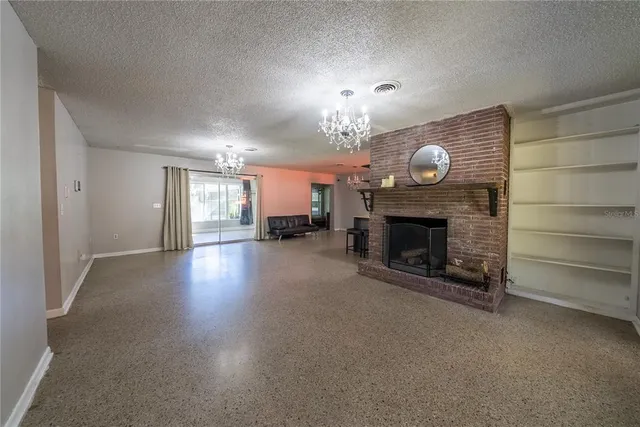 a kitchen with stainless steel appliances granite countertop a stove and a refrigerator