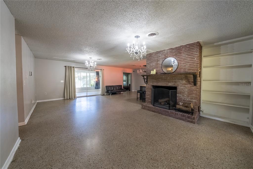 1740 Southeast 164th Circle Ocklawaha, FL 32179 - Photo 4 of 48 a view of a livingroom with a fireplace a window and a fireplace
