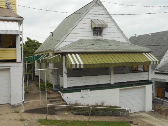 a view of house along the side of street