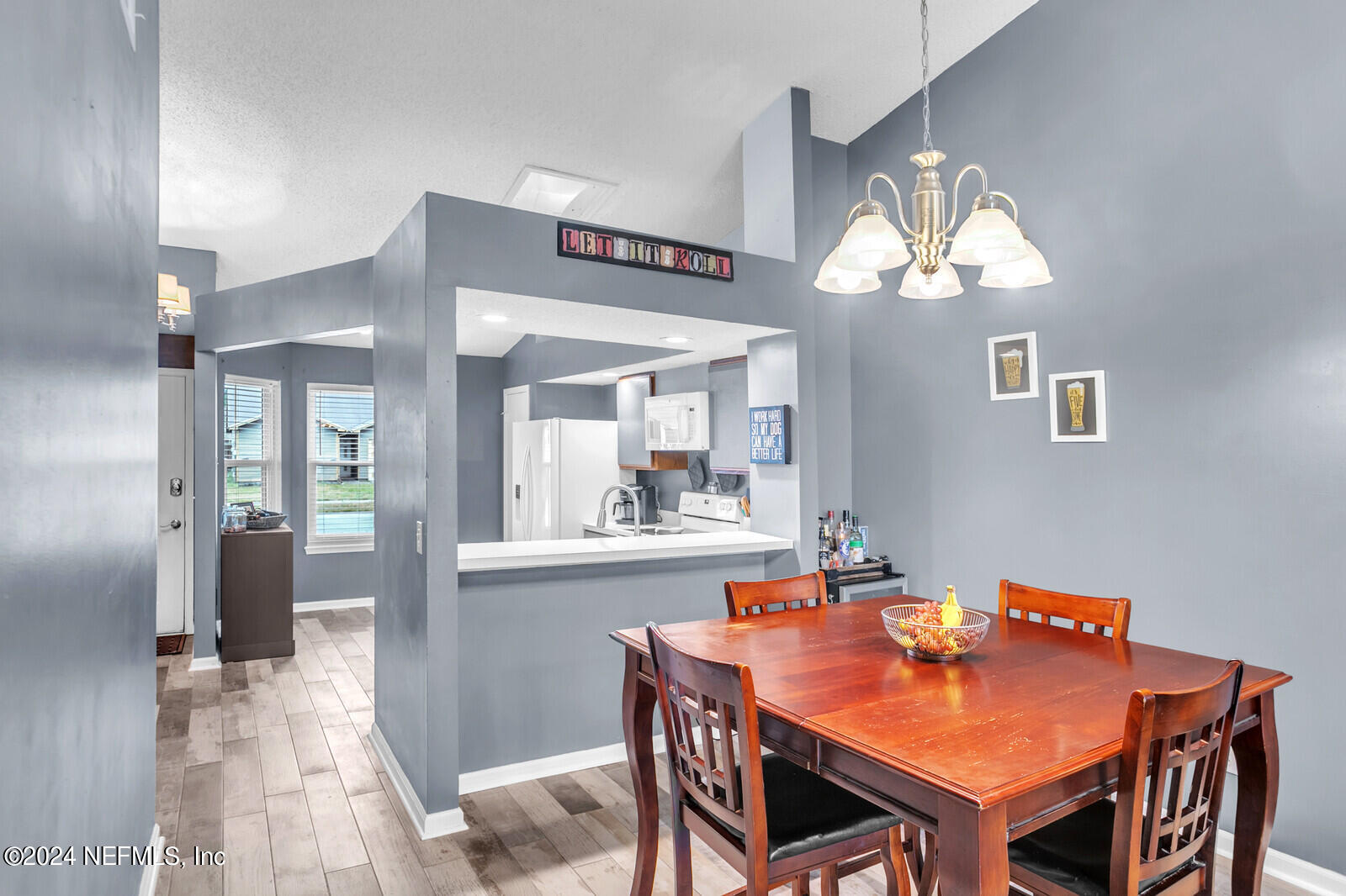 2476 Spring Vale Road Jacksonville, FL 32246 - Photo 11 of 16 a dining room with a table and chairs