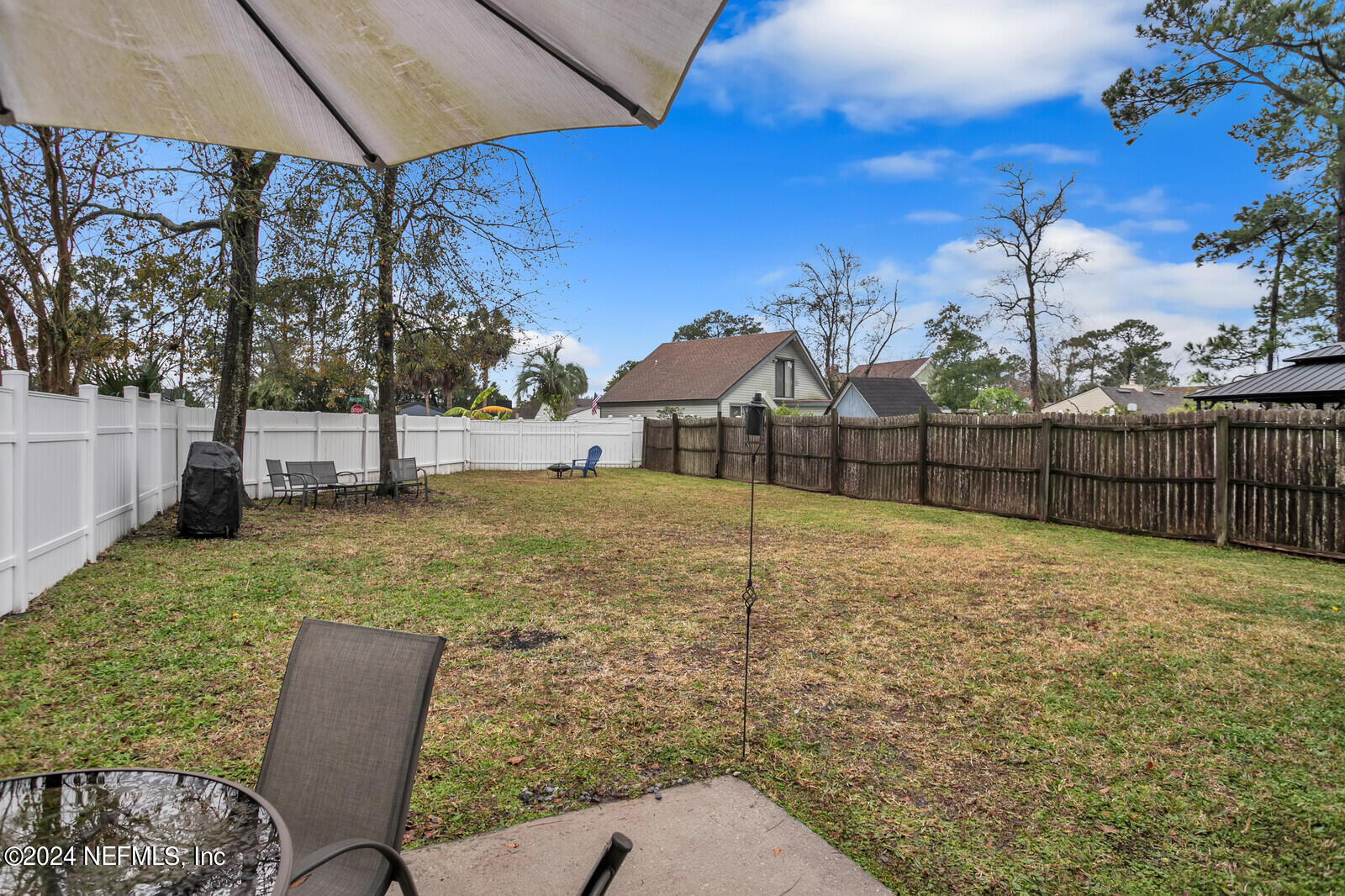 2476 Spring Vale Road Jacksonville, FL 32246 - Photo 2 of 16 a view of backyard with outdoor seating