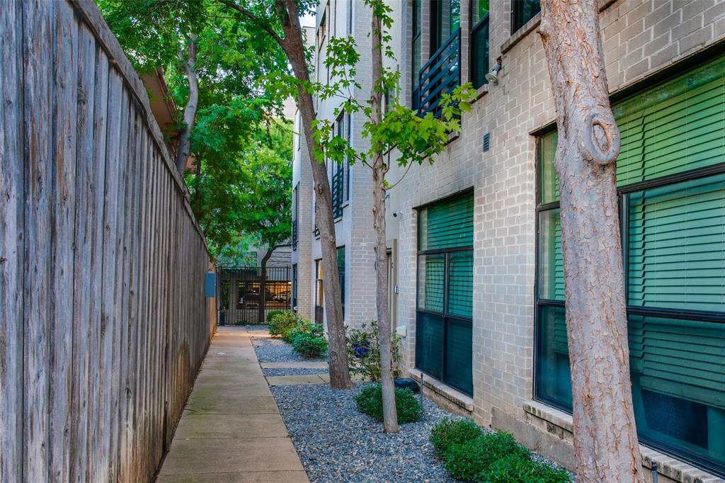 4618 Cedar Springs Road, Unit D Dallas, TX 75219 - Photo 11 of 29 a view of a pathway with a house front door