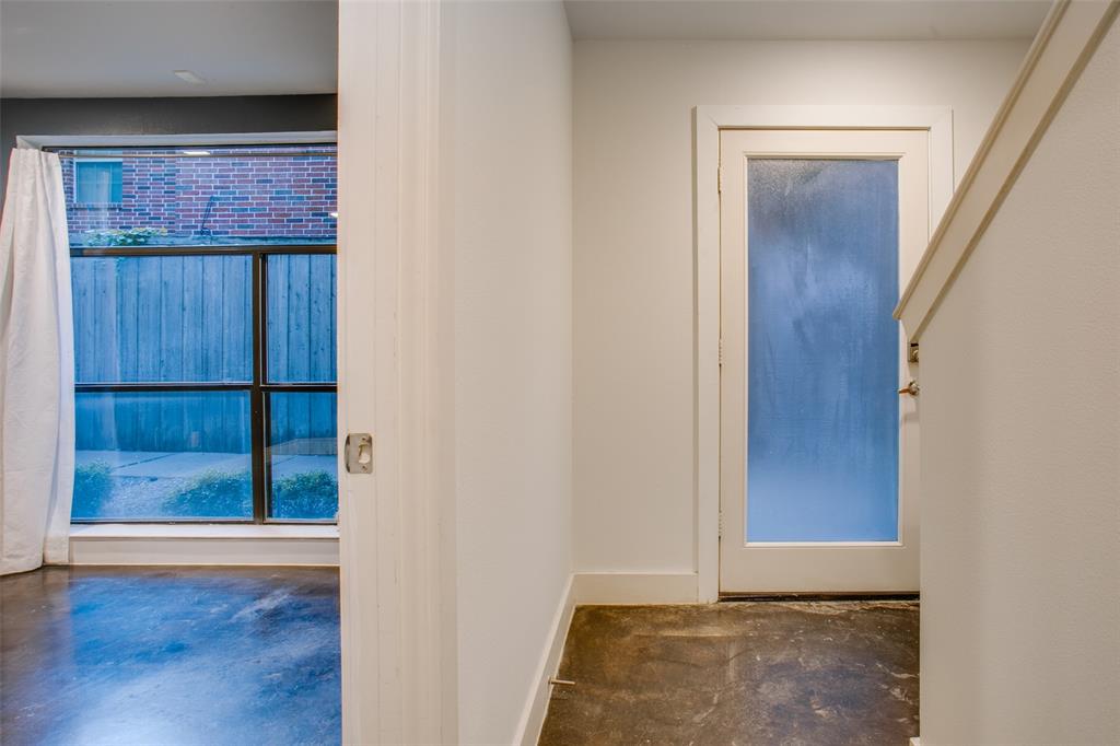 4618 Cedar Springs Road, Unit D Dallas, TX 75219 - Photo 12 of 29 an empty room with wooden floor and windows