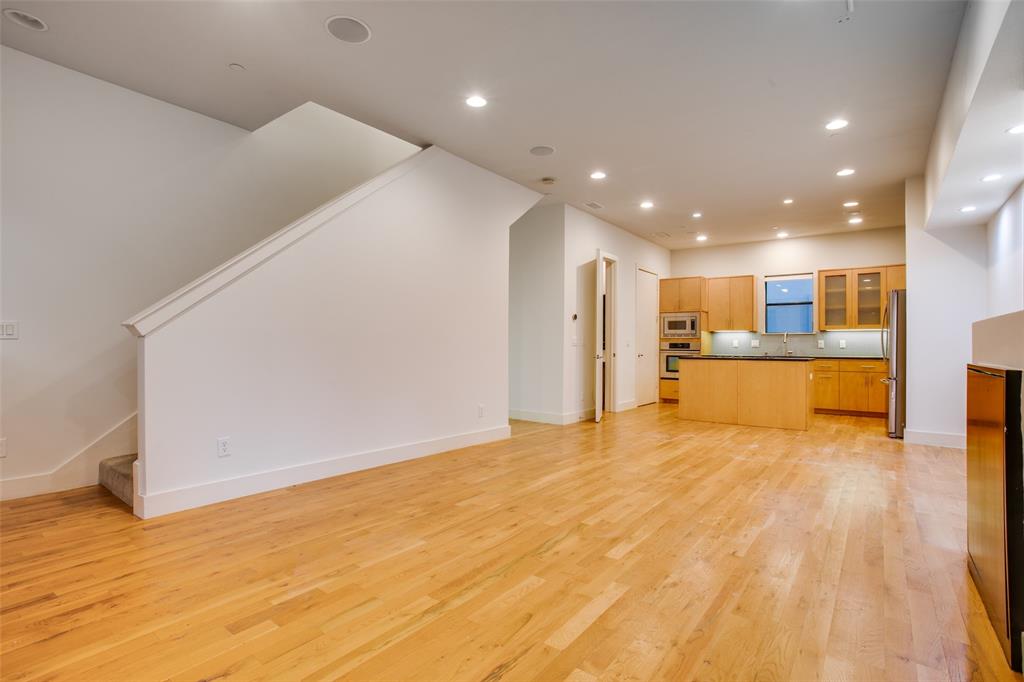 4618 Cedar Springs Road, Unit D Dallas, TX 75219 - Photo 22 of 29 a view of an empty room with wooden floor