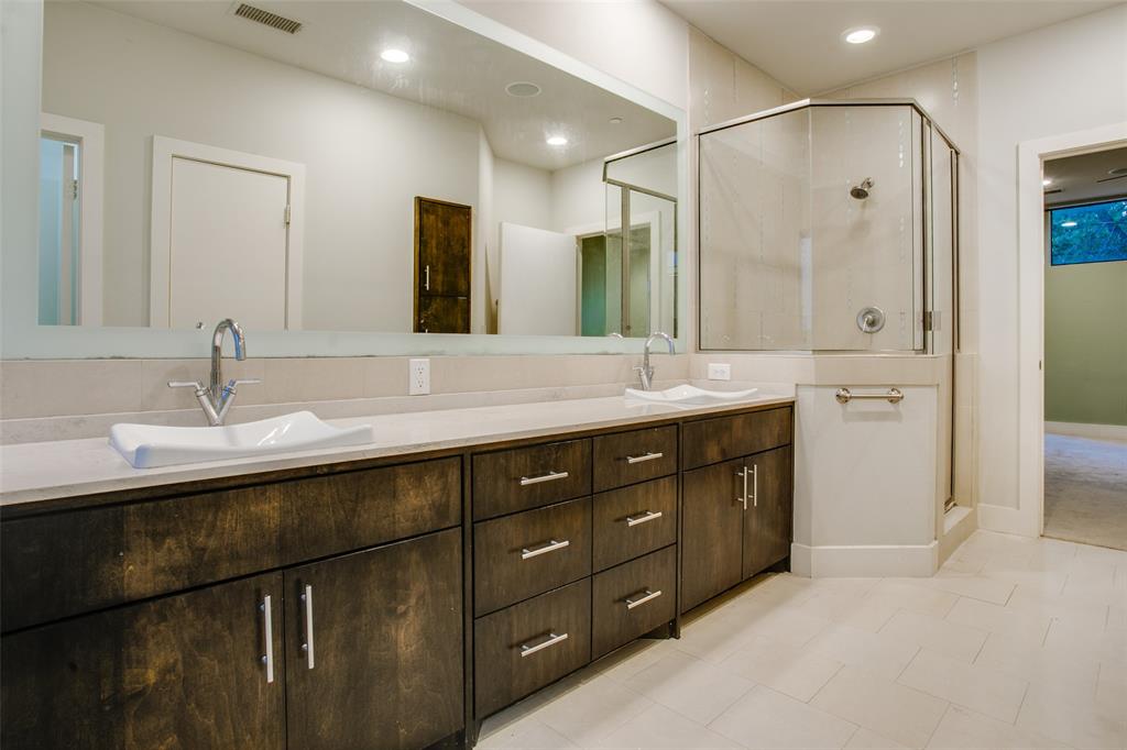 4618 Cedar Springs Road, Unit D Dallas, TX 75219 - Photo 26 of 29 a bathroom with a double vanity sink and mirror