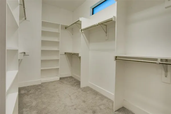 a view of an empty walk in closet