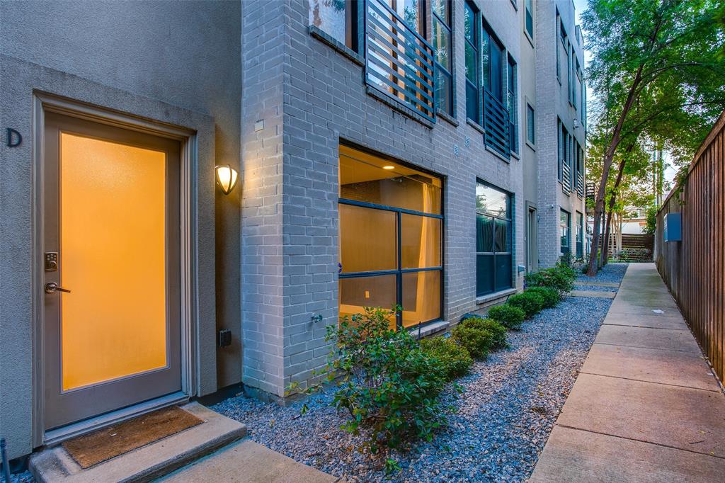 4618 Cedar Springs Road, Unit D Dallas, TX 75219 - Photo 10 of 29 a view of a brick house with a large window