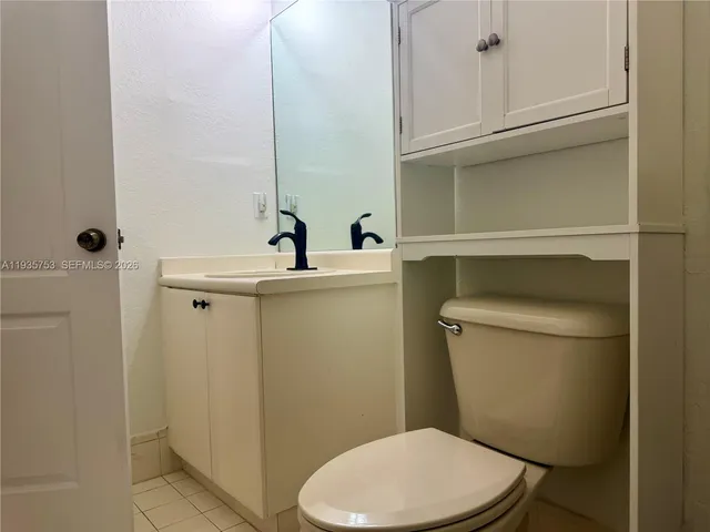 a bathroom with a toilet and a sink