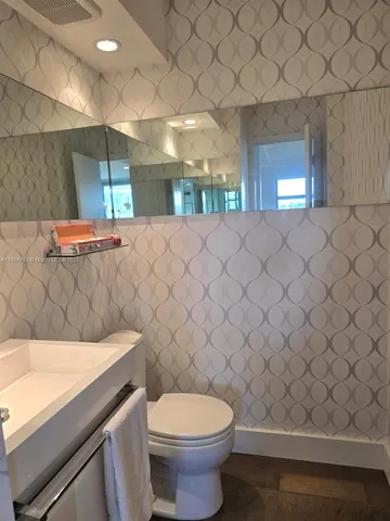 a bathroom with a sink and a toilet