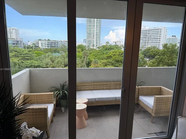 a balcony with furniture and city view