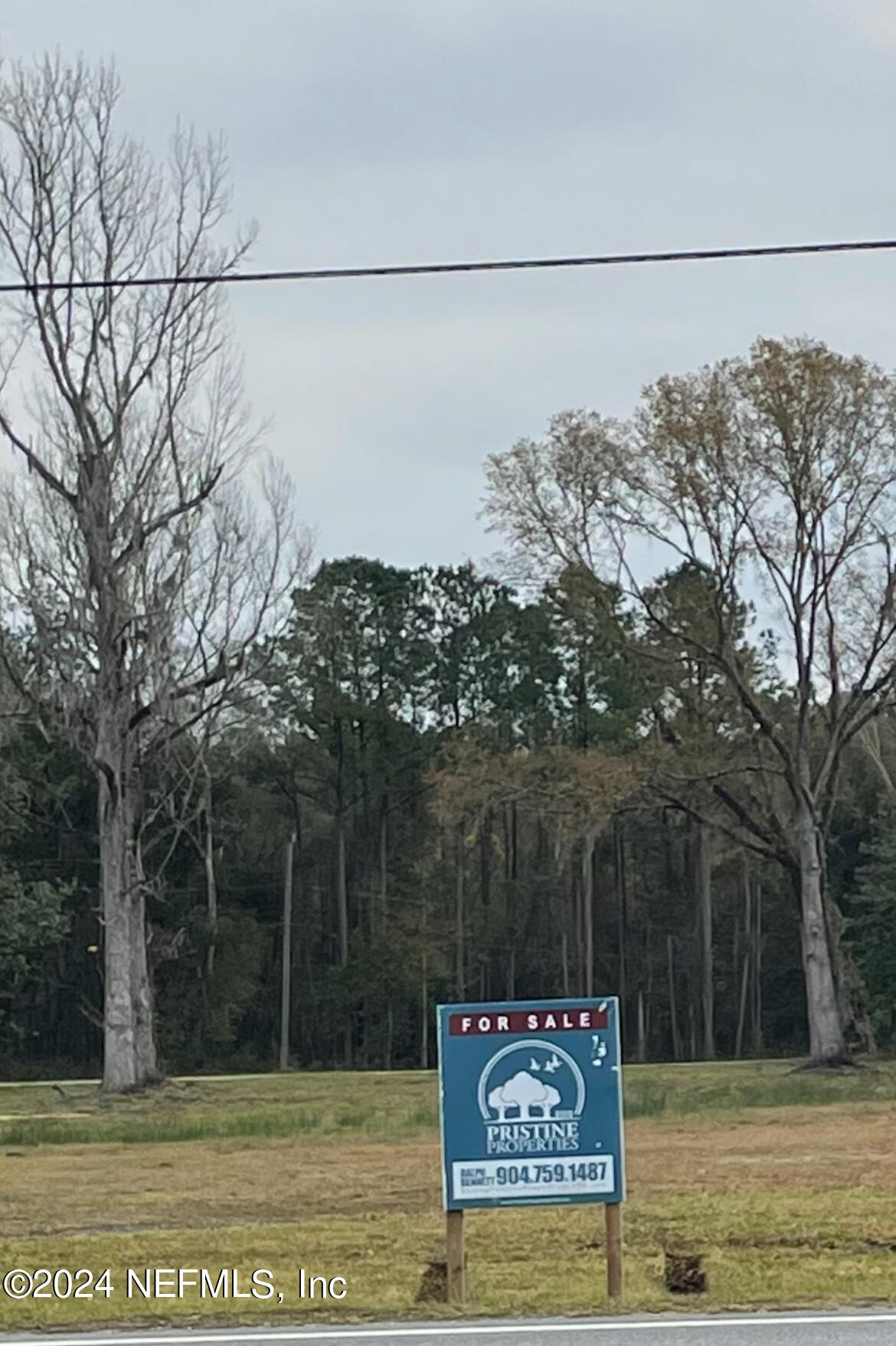 542088 Highway 1 Callahan, FL 32011 - Photo 2 of 3 a sign on the side of a road