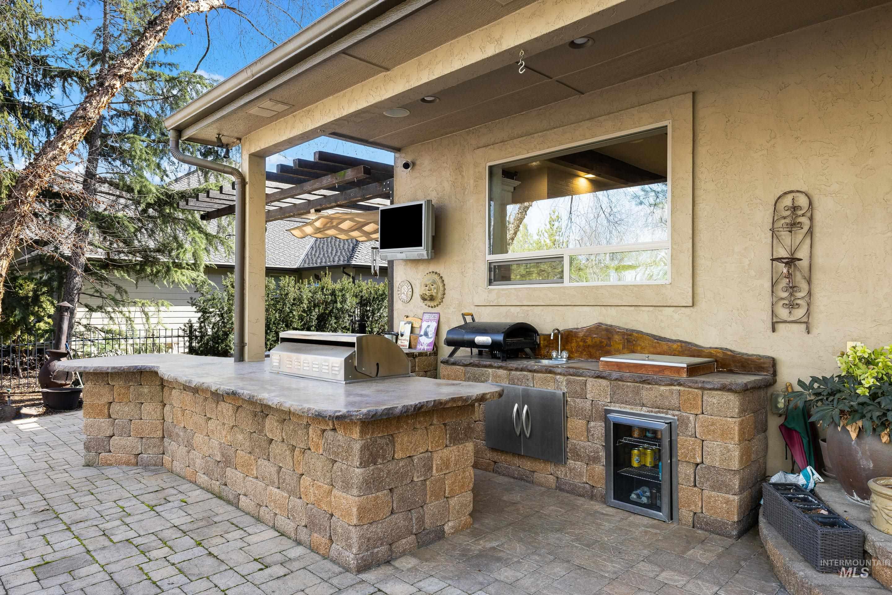 1166 East Rivers End Drive Eagle, ID 83616 - Photo 44 of 50 View of patio featuring a pergola and an outdoor kitchen