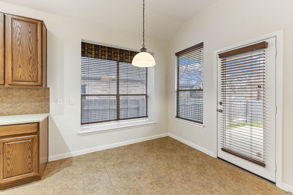 2134 Paradise Ridge Drive Round Rock, TX 78665 - Photo 12 of 28 a view of an empty room with a window and cabinet area