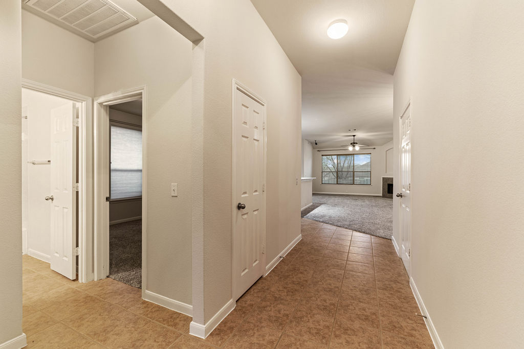 2134 Paradise Ridge Drive Round Rock, TX 78665 - Photo 18 of 28 a view of a hallway with wooden floor