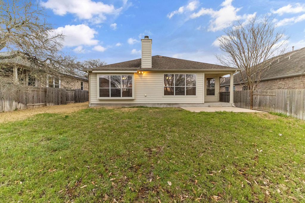 2134 Paradise Ridge Drive Round Rock, TX 78665 - Photo 25 of 28 a front view of a house with a yard