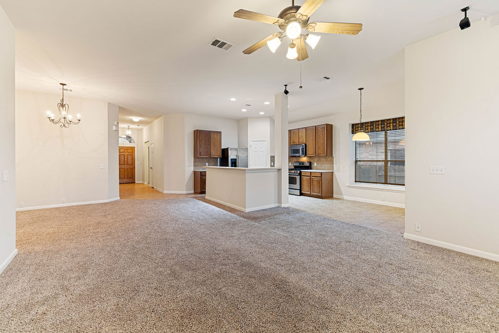 2134 Paradise Ridge Drive Round Rock, TX 78665 - Photo 4 of 28 a view of a kitchen with a sink and a refrigerator