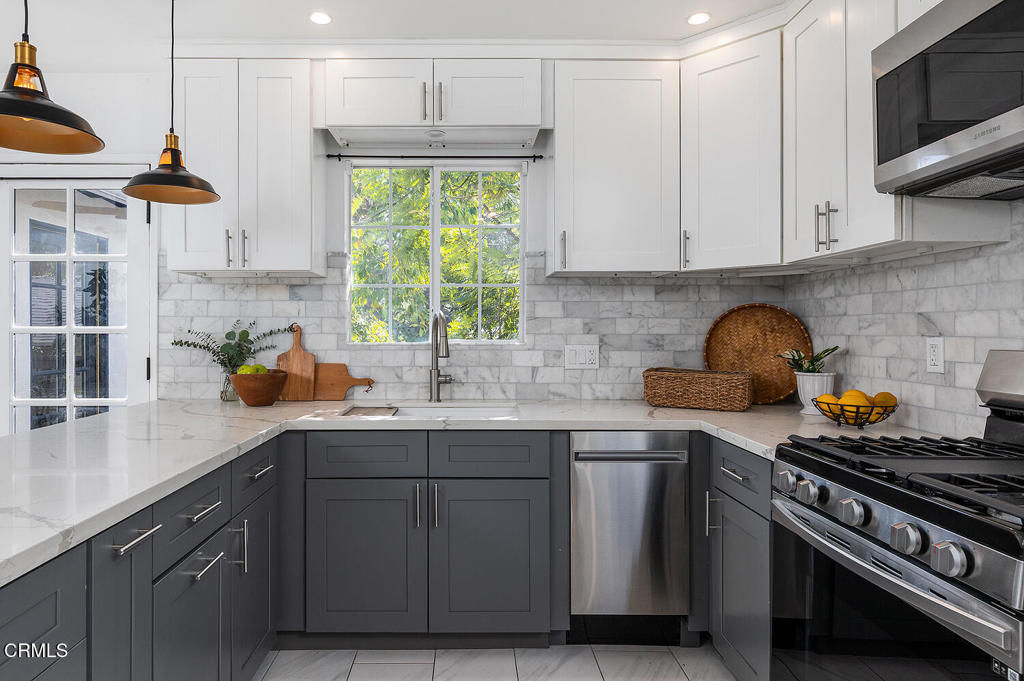 1202 East Lexington Street Pasadena, CA 91104 - Photo 11 of 39 a kitchen with stainless steel appliances a sink a stove and cabinets