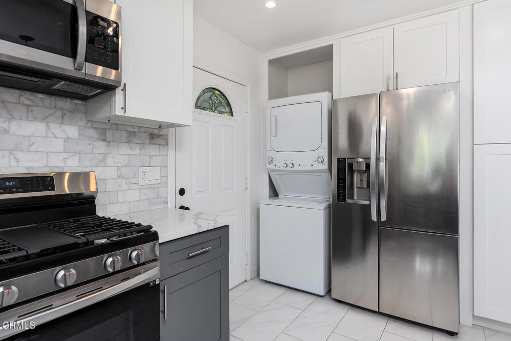 1202 East Lexington Street Pasadena, CA 91104 - Photo 12 of 39 a kitchen with stainless steel appliances granite countertop a refrigerator and a stove