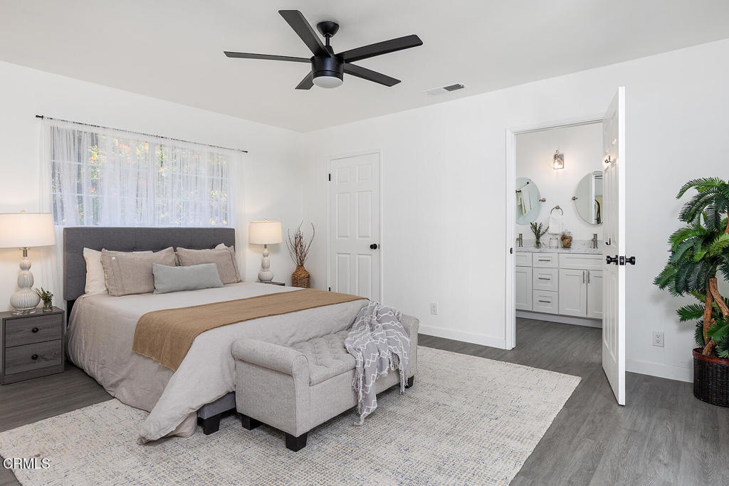 1202 East Lexington Street Pasadena, CA 91104 - Photo 13 of 39 a spacious bedroom with a bed and a potted plant