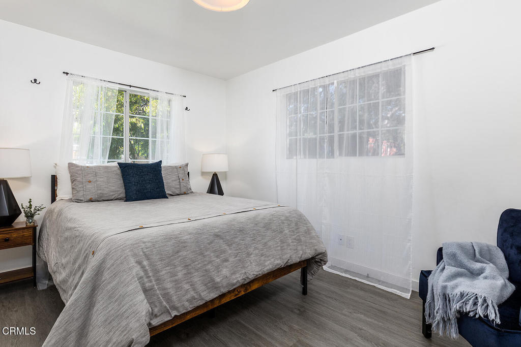 1202 East Lexington Street Pasadena, CA 91104 - Photo 18 of 39 a bedroom with a bed and windows