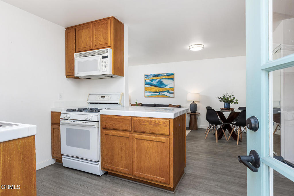 1202 East Lexington Street Pasadena, CA 91104 - Photo 25 of 39 a view of kitchen with sink and wooden floor